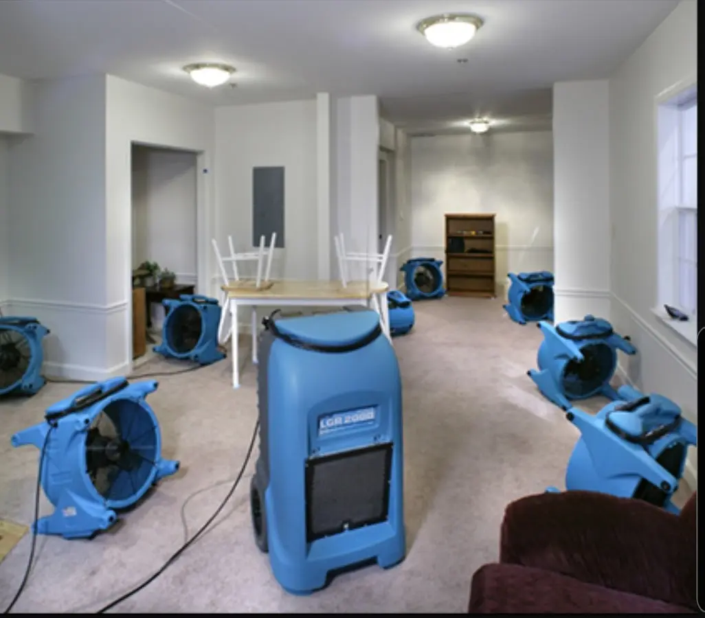 Air movers and dehumidifier setup for Water Damage Restoration in Pepperell